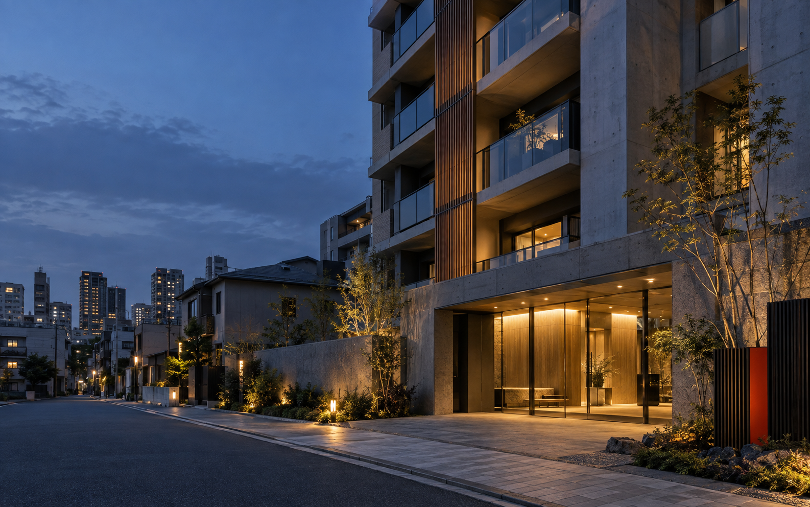 夕暮れの日本の都市に建つ、温かな灯りのモダンな集合住宅